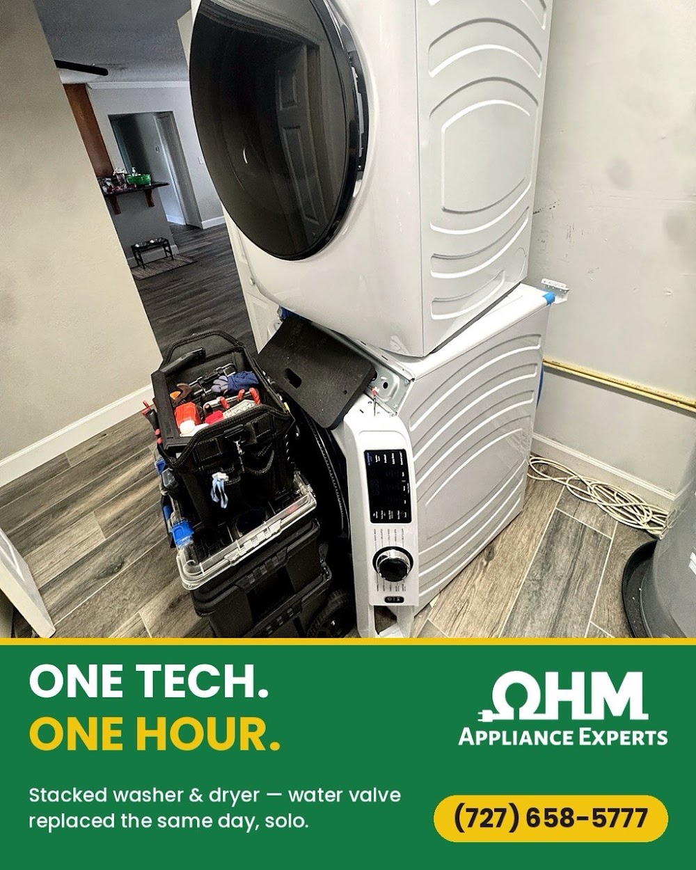 Technician repairing a washing machine in a Lutz, FL home
